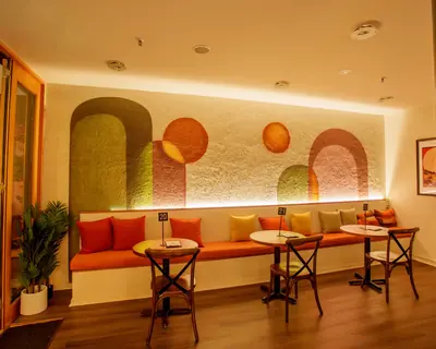 Warm booth seating inside Atrio