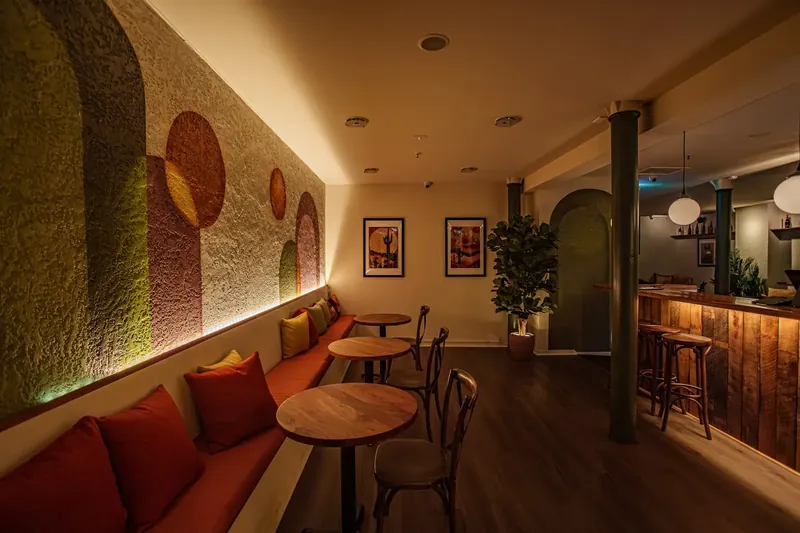 Atrio Bar with booths and bar seating inside Gibsons Mill