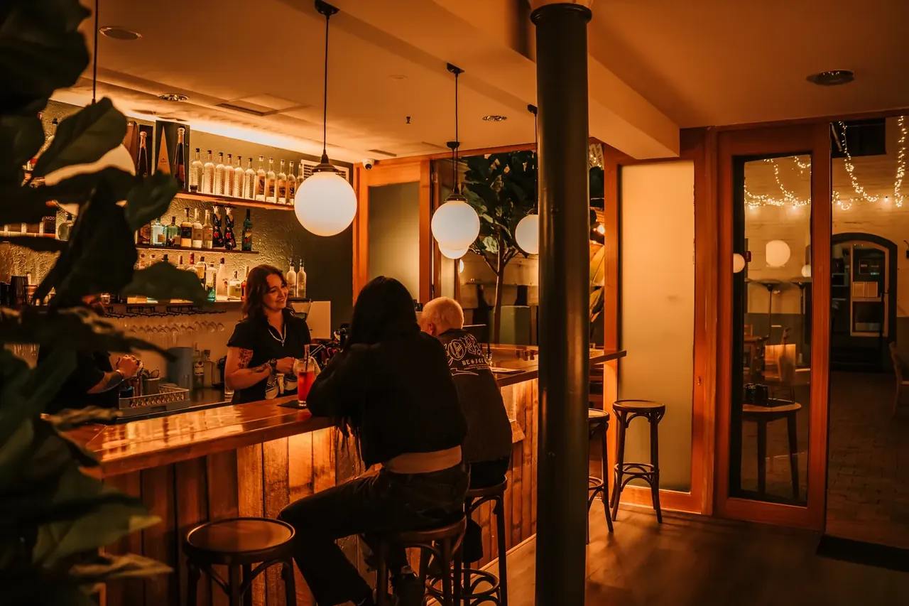 Guests enjoying cocktails at Atrio Bar