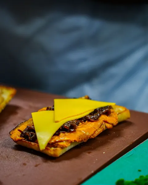 Toasted sandwich with melted cheese at Atrio