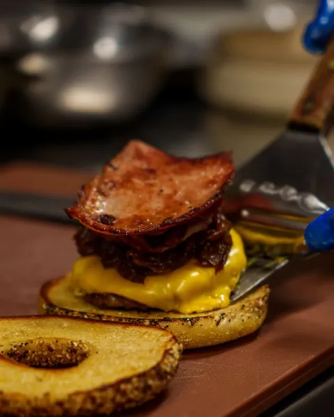 Loaded burger being assembled at Atrio